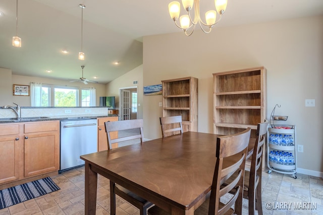 709 Wild Flower Dr, Wayland, MI 49348 - dining space featuring stone tile floors, a ceiling fan, a chandelier, baseboards, and high vaulted ceiling