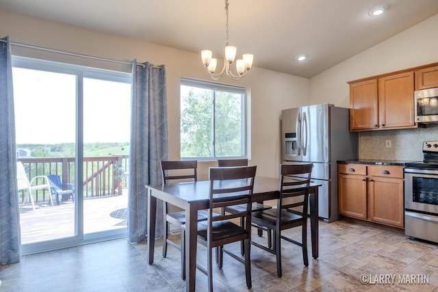 709 Wild Flower Dr, Wayland, MI 49348 - dining area with a chandelier, vaulted ceiling, and recessed lighting