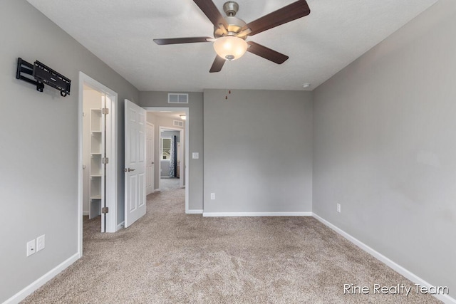 4335 Norway St, Holt, MI 48842 - spare room featuring a ceiling fan, carpet floors, and baseboards