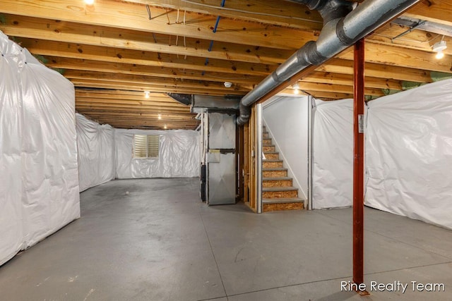 4335 Norway St, Holt, MI 48842 - unfinished basement with stairway and heating unit