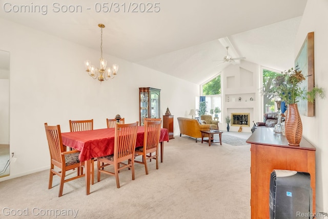 48757 Tilford Ct, Shelby Twp, MI 48315 - dining space with light colored carpet, ceiling fan, a fireplace, a chandelier, and high vaulted ceiling