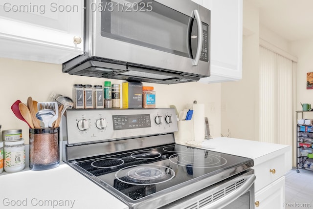 48757 Tilford Ct, Shelby Twp, MI 48315 - kitchen featuring stainless steel appliances, white cabinets, and light countertops