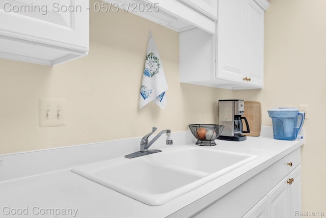48757 Tilford Ct, Shelby Twp, MI 48315 - kitchen with a sink, white cabinets, and light countertops