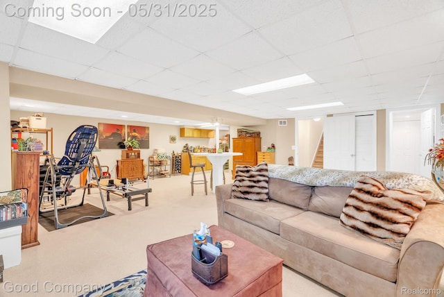 48757 Tilford Ct, Shelby Twp, MI 48315 - living room with light colored carpet, a paneled ceiling, and stairs
