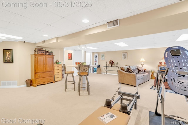 48757 Tilford Ct, Shelby Twp, MI 48315 - workout room featuring light carpet, a paneled ceiling, and baseboards