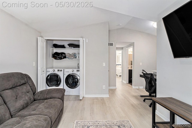 9475 Beechcrest Dr, White Lake, MI 48386 - laundry area with washer and clothes dryer, light wood-style flooring, and baseboards