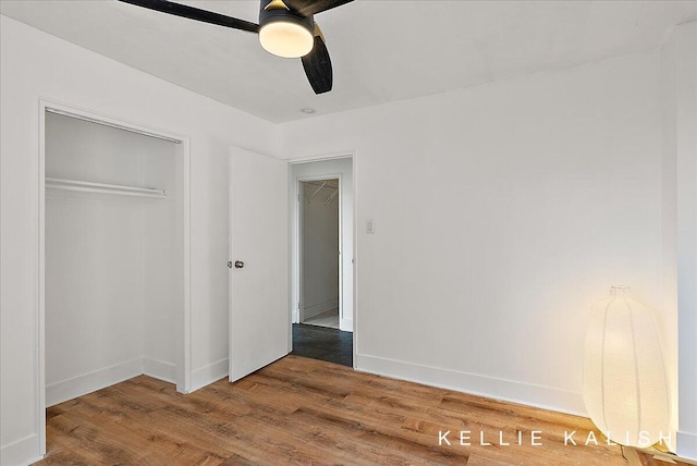 505 Cherry St SE Unit 612, Grand Rapids, MI 49503 - unfurnished bedroom featuring wood finished floors, a closet, baseboards, and a ceiling fan