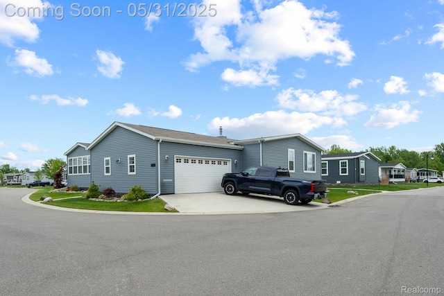 8551 Boyer Dr, Willis, MI 48191 - view of front of home with an attached garage and driveway