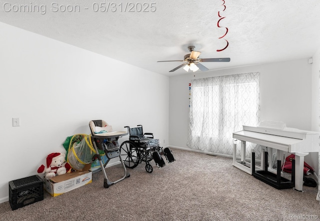 8551 Boyer Dr, Willis, MI 48191 - recreation room featuring carpet floors, ceiling fan, a textured ceiling, and baseboards