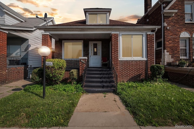 3435 Holbrook St, Hamtramck, MI 48212 - property entrance with a porch and brick siding