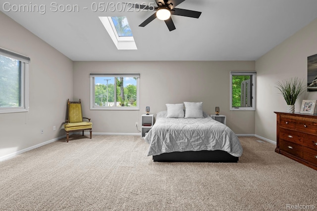 50820 Marsha Ln, New Baltimore, MI 48047 - bedroom featuring carpet, a skylight, baseboards, vaulted ceiling, and ceiling fan
