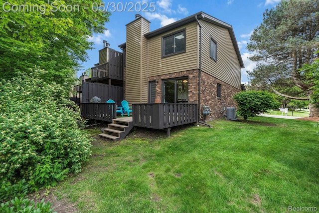 50820 Marsha Ln, New Baltimore, MI 48047 - rear view of property with brick siding, a lawn, central AC unit, a chimney, and a wooden deck