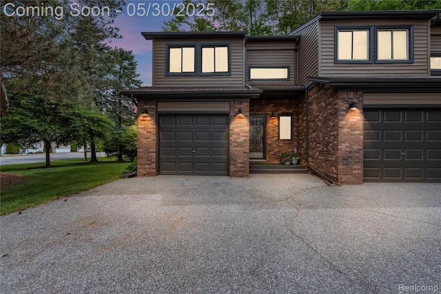 50820 Marsha Ln, New Baltimore, MI 48047 - view of front of property with an attached garage, driveway, and brick siding