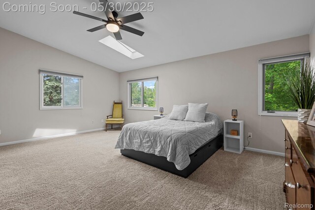 50820 Marsha Ln, New Baltimore, MI 48047 - carpeted bedroom featuring a skylight, vaulted ceiling, baseboards, and a ceiling fan