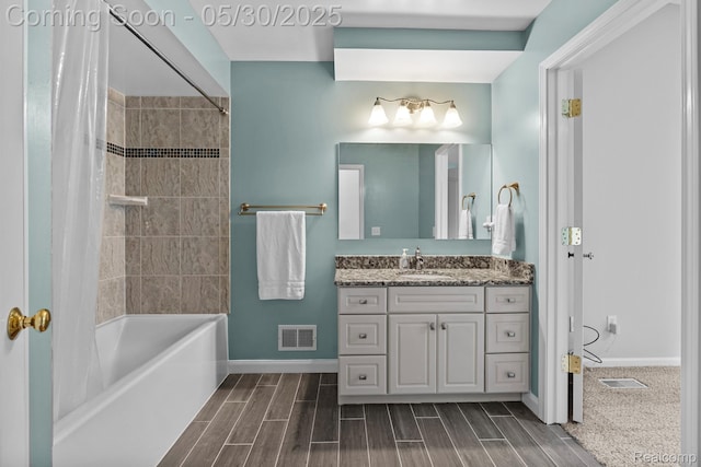 50820 Marsha Ln, New Baltimore, MI 48047 - bathroom featuring vanity, baseboards, shower / bathtub combination with curtain, and wood finished floors