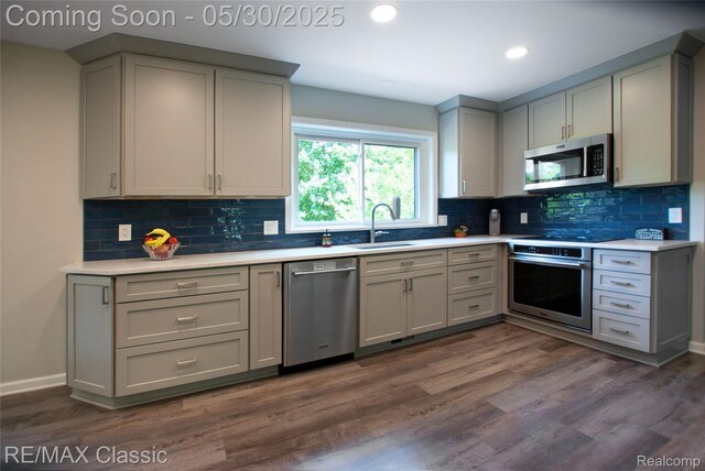 44500 Louvert Ct, Novi, MI 48375 - kitchen with stainless steel appliances, a sink, gray cabinets, light countertops, and recessed lighting