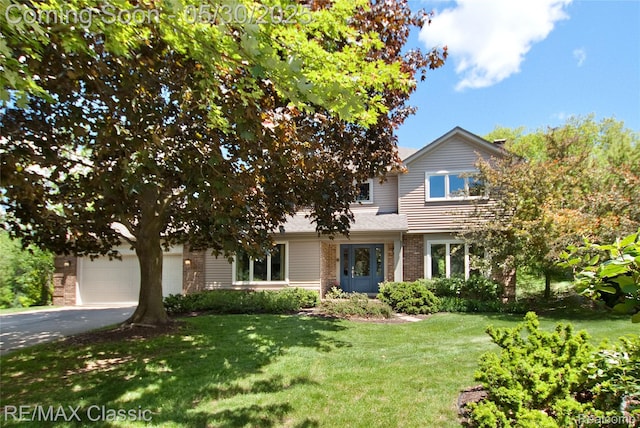 44500 Louvert Ct, Novi, MI 48375 - view of front facade featuring brick siding, driveway, a front lawn, and a garage