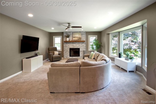 44500 Louvert Ct, Novi, MI 48375 - living area featuring carpet flooring, baseboards, recessed lighting, plenty of natural light, and a stone fireplace