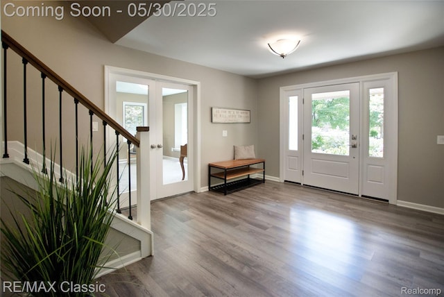 44500 Louvert Ct, Novi, MI 48375 - foyer with stairs, wood finished floors, baseboards, and french doors