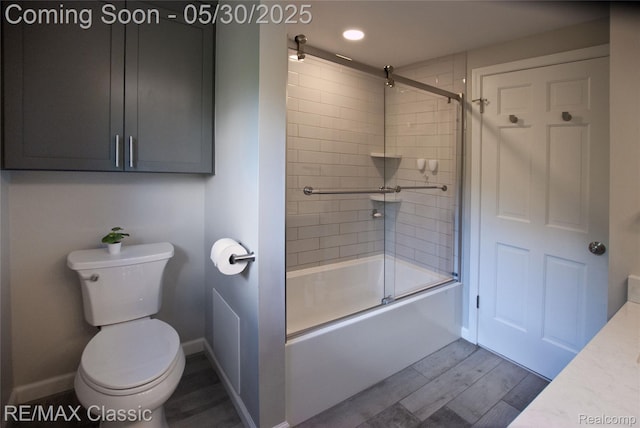 44500 Louvert Ct, Novi, MI 48375 - full bathroom with toilet, wood finished floors, combined bath / shower with glass door, vanity, and baseboards