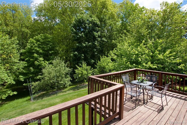 44500 Louvert Ct, Novi, MI 48375 - deck with outdoor dining area and a lawn