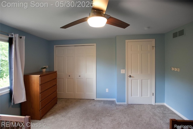 44500 Louvert Ct, Novi, MI 48375 - unfurnished bedroom featuring a closet, light colored carpet, baseboards, and a ceiling fan