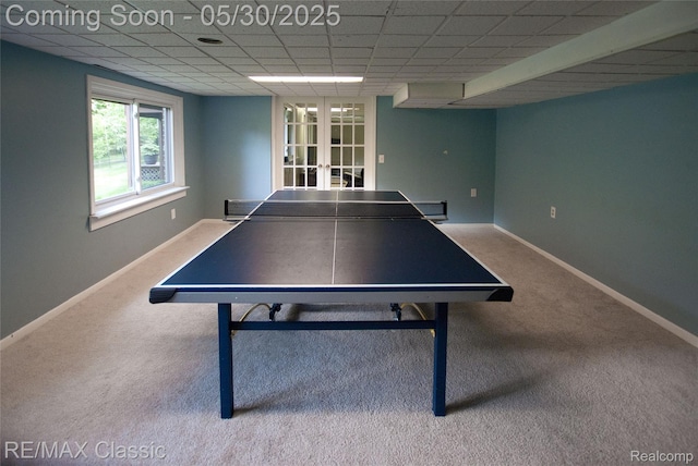 44500 Louvert Ct, Novi, MI 48375 - game room featuring carpet flooring, french doors, a drop ceiling, and baseboards