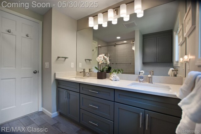 44500 Louvert Ct, Novi, MI 48375 - full bath featuring double vanity, a tile shower, and wood finished floors