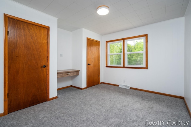 9081 E Baker Rd, Hesperia, MI 49421 - unfurnished bedroom featuring carpet floors, baseboards, and a closet