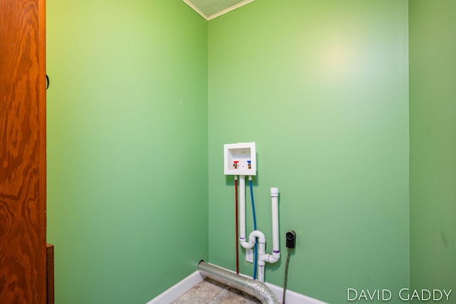 9081 E Baker Rd, Hesperia, MI 49421 - laundry area featuring crown molding, baseboards, and washer hookup
