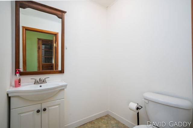 9081 E Baker Rd, Hesperia, MI 49421 - half bath with vanity, toilet, and baseboards