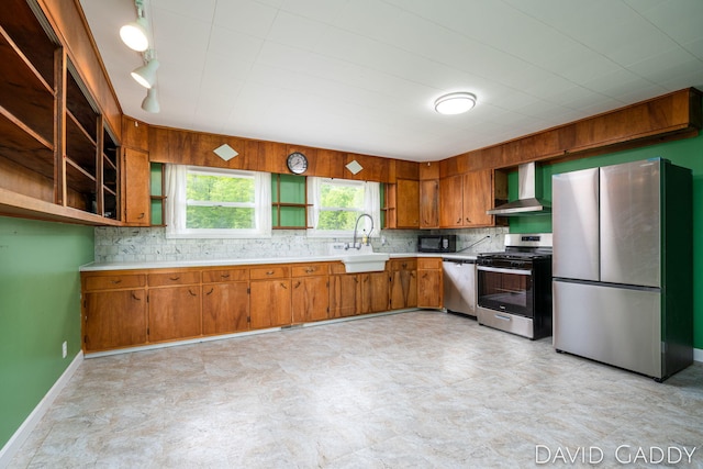 9081 E Baker Rd, Hesperia, MI 49421 - kitchen featuring stainless steel appliances, a sink, wall chimney exhaust hood, brown cabinetry, and light countertops