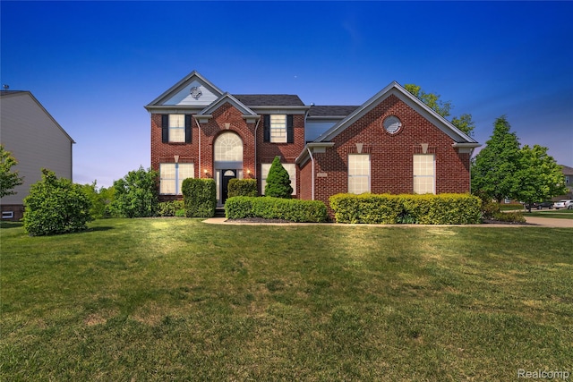 6241 Sapphire Ct, Grand Blanc, MI 48439 - view of front of house with brick siding and a front lawn