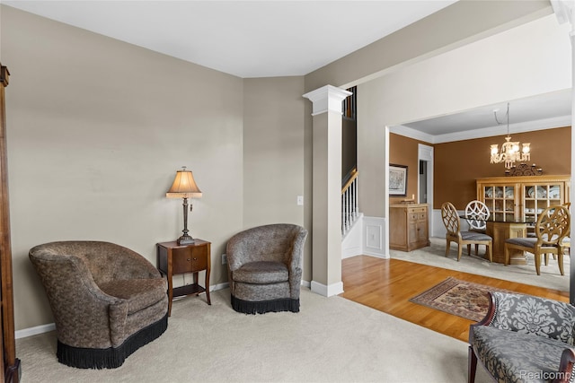 6241 Sapphire Ct, Grand Blanc, MI 48439 - carpeted living area featuring a chandelier, stairs, baseboards, and ornamental molding