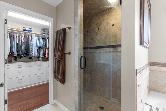 6241 Sapphire Ct, Grand Blanc, MI 48439 - bathroom featuring a shower stall and a walk in closet