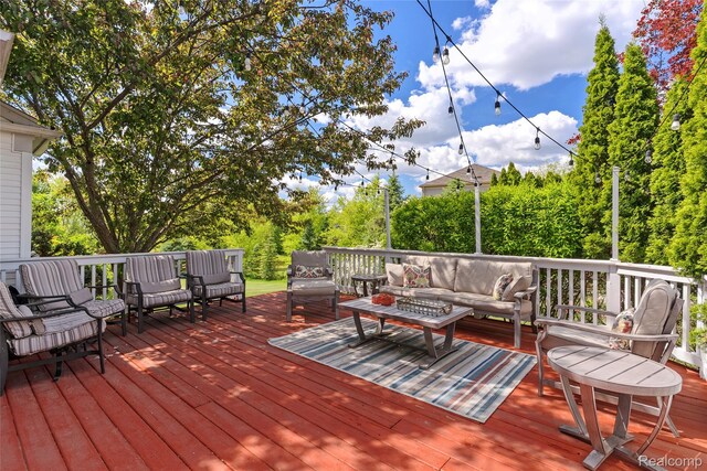 6241 Sapphire Ct, Grand Blanc, MI 48439 - deck with an outdoor hangout area and view of scattered trees