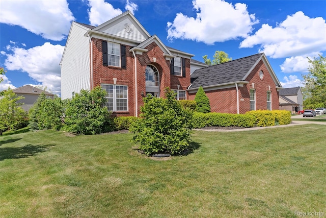 6241 Sapphire Ct, Grand Blanc, MI 48439 - view of front of home featuring brick siding and a front lawn