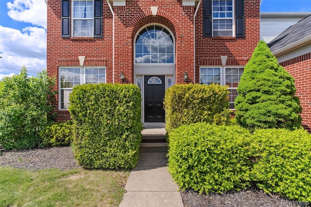 6241 Sapphire Ct, Grand Blanc, MI 48439 - view of exterior entry featuring brick siding