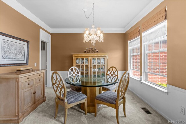 6241 Sapphire Ct, Grand Blanc, MI 48439 - dining area featuring light colored carpet, a chandelier, and crown molding