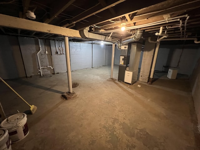 1008 S Holmes St, Lansing, MI 48912 - unfinished basement featuring heating unit