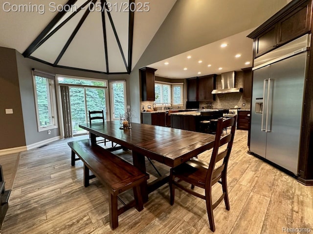 52006 Finch Ct, Shelby Twp, MI 48315 - dining room with light wood finished floors, high vaulted ceiling, baseboards, and recessed lighting