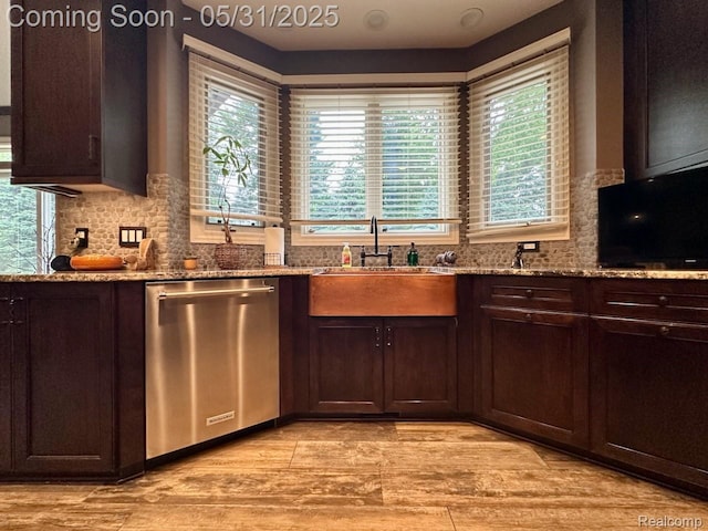52006 Finch Ct, Shelby Twp, MI 48315 - kitchen with dishwasher, a sink, decorative backsplash, and light stone countertops