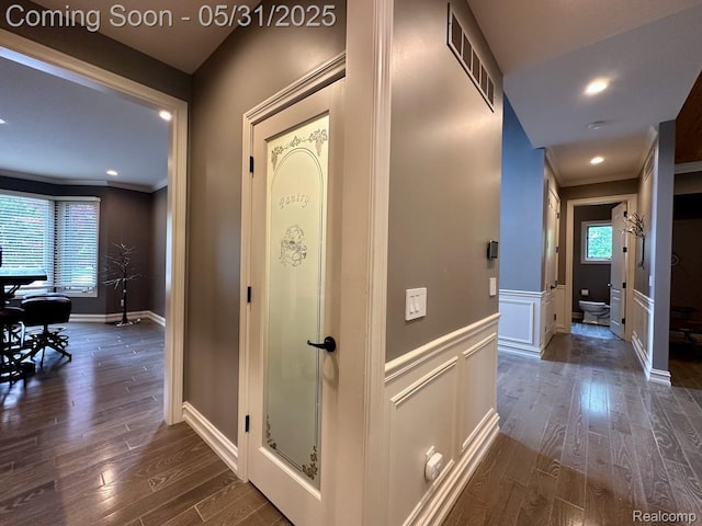 52006 Finch Ct, Shelby Twp, MI 48315 - hall with crown molding, dark wood-type flooring, a decorative wall, wainscoting, and recessed lighting