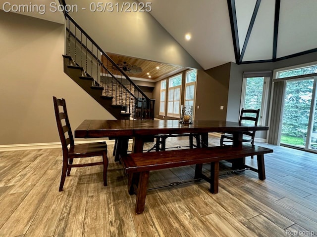 52006 Finch Ct, Shelby Twp, MI 48315 - dining space with wood finished floors, high vaulted ceiling, healthy amount of natural light, stairway, and recessed lighting