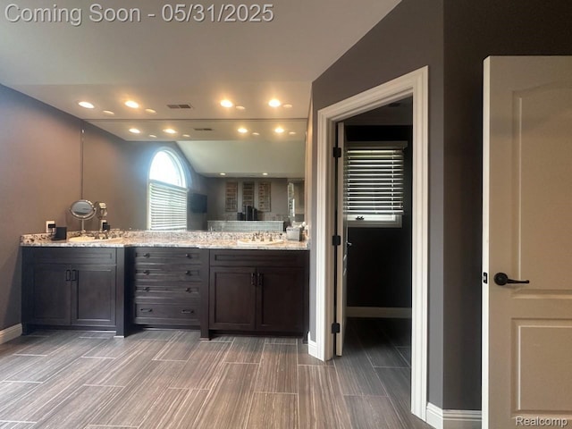 52006 Finch Ct, Shelby Twp, MI 48315 - full bathroom with double vanity, baseboards, recessed lighting, and wood finish floors