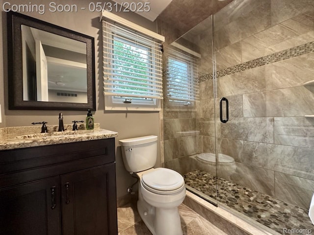 52006 Finch Ct, Shelby Twp, MI 48315 - full bathroom featuring toilet, vanity, and a stall shower