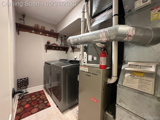 52006 Finch Ct, Shelby Twp, MI 48315 - washroom with independent washer and dryer and light tile patterned floors