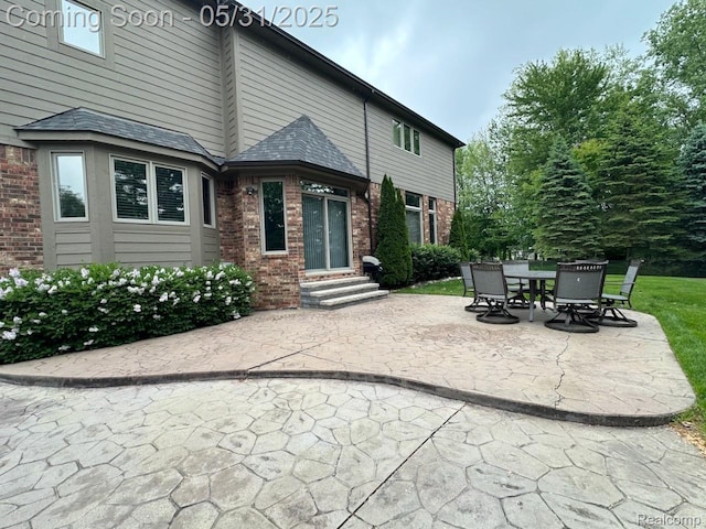 52006 Finch Ct, Shelby Twp, MI 48315 - view of patio featuring entry steps and outdoor dining space