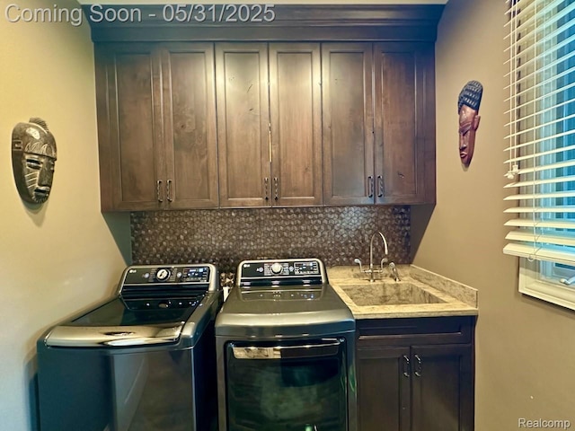 52006 Finch Ct, Shelby Twp, MI 48315 - washroom with washing machine and clothes dryer and cabinet space