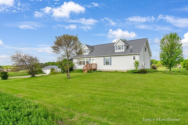 5777 N Broadway, Freeport, MI 49325 - back of property featuring a lawn and roof with shingles